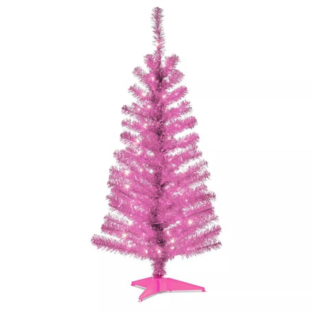 A pre-lit pink Christmas tree is a great start to Barbiecore holiday decor. 