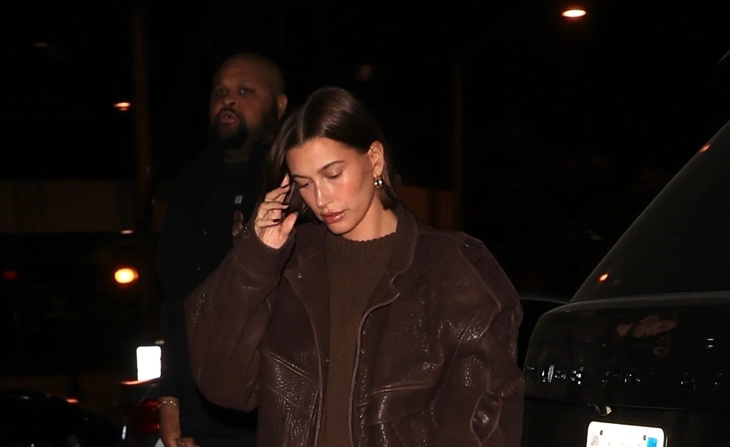 Hailey Bieber's Pantless Look Mixes a Boxy Moto Jacket With a Quirky Prep  Shoe