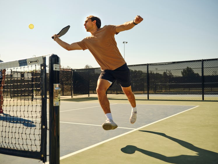 A man playing pickleball.