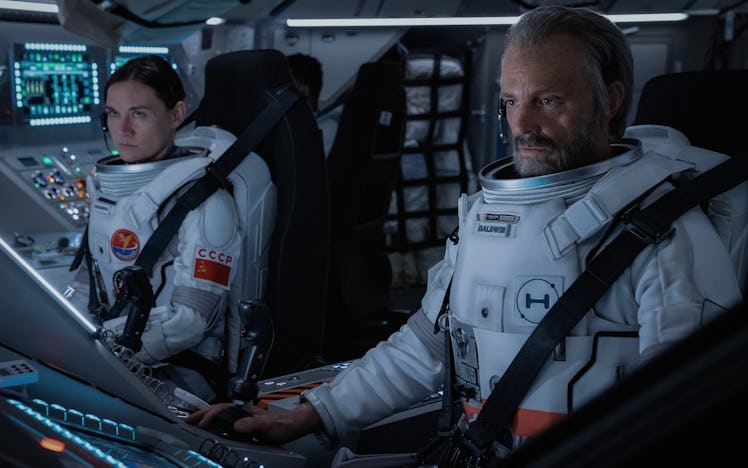 Svetlana (Masha Mashkova) and Ed (Joel Kinnaman) in the cockpit.
