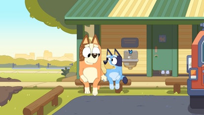 Chilli and Bluey sit on a rest station bench in "The Sign," a new, extra long episode of 'Bluey' com...