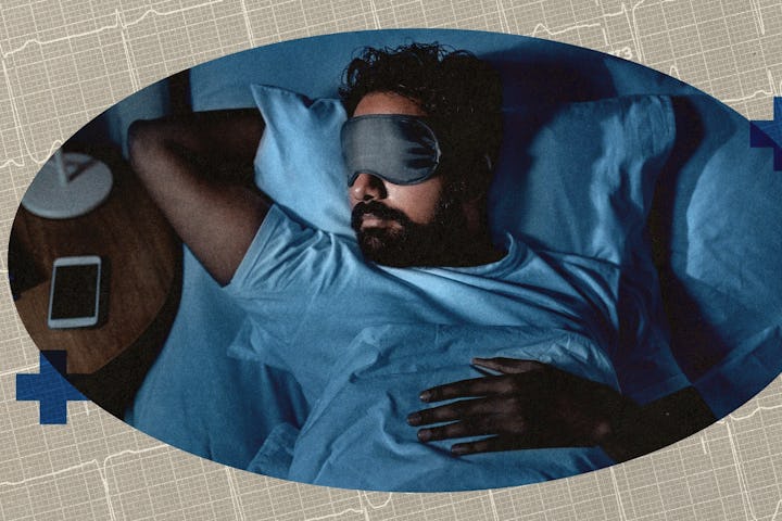 A man in a sleep mask in bed.
