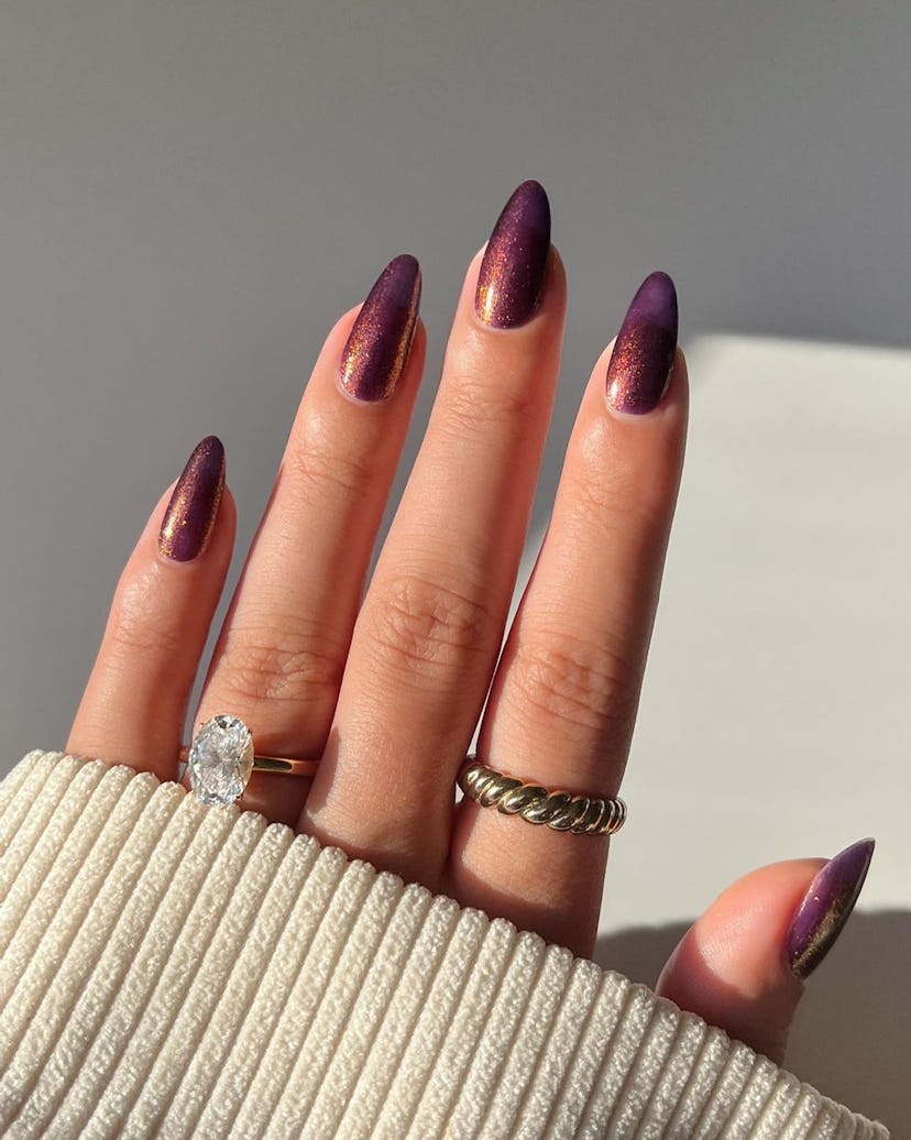 Plum nail polish is an on-trend holiday nail polish color for 2023.