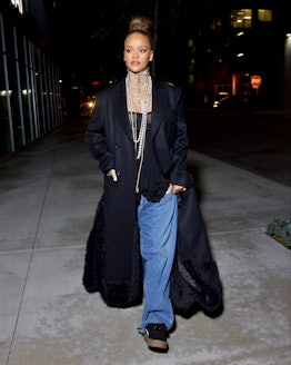 Rihanna wore a semi-sheer exposed bra underneath a John Galliano Dior archival pearl necklace