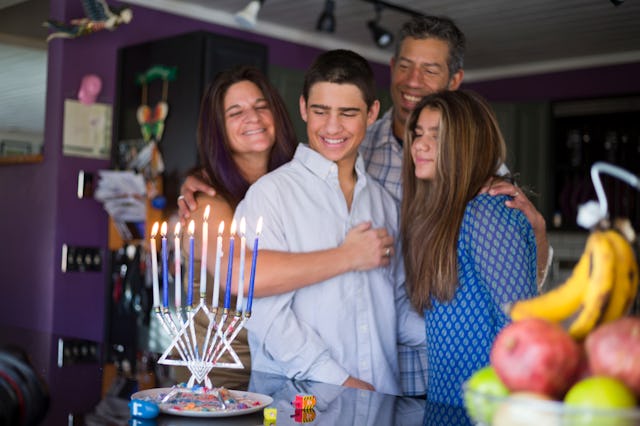 A family gathers together to celebrate Hanukkah.