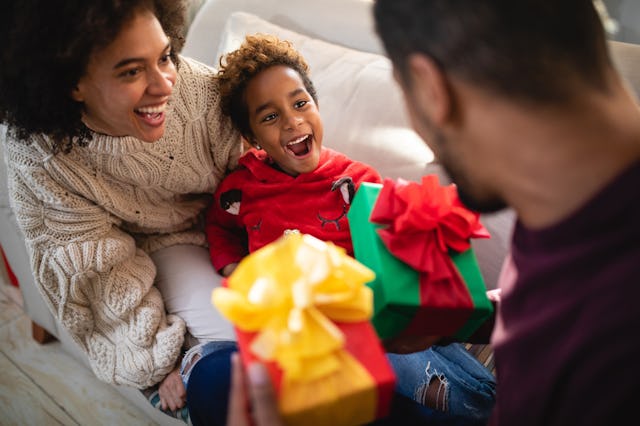 A family celebrates their child's birthday during the month of December.