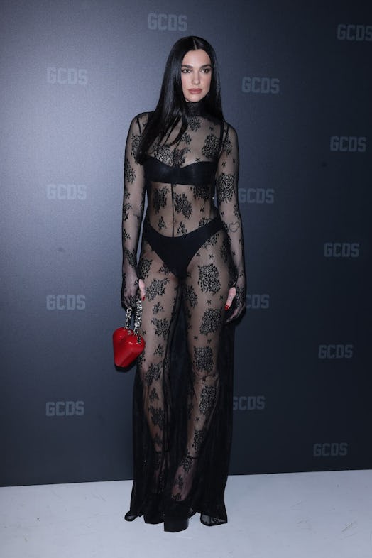 Dua Lipa wears a sheer LBD to Milan Fashion Week.