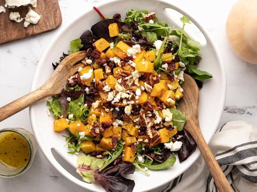 A make-ahead Christmas dinner side dish, butternut squash salad with greens and pecans.