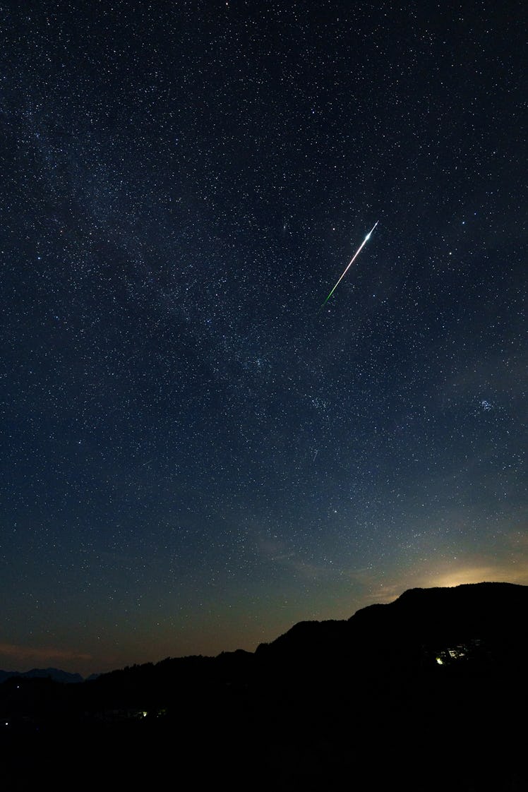 NANJING, CHINA - AUGUST 14: A meteor streaks across the sky during the Perseid meteor shower on Augu...