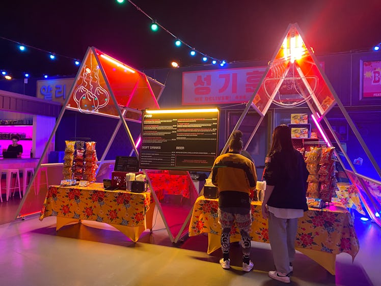 The 'Squid Game' experience in Los Angeles has a night market with food and drinks. 