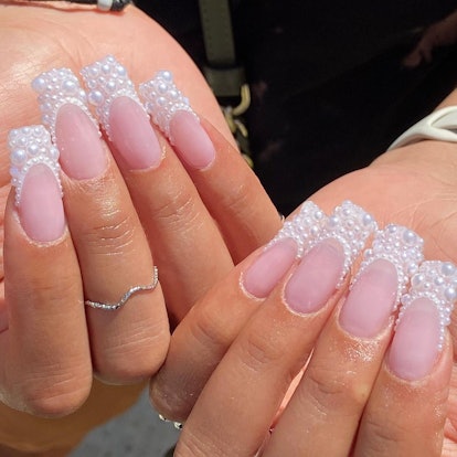 Pearl French tip nails are an on-trend manicure design idea for long, square-shaped New Year's Eve 2...