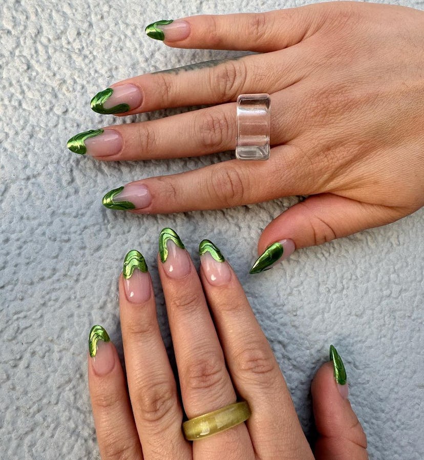 Green chrome French tip nails with 3D lines are an on-trend Capricorn nail design for 2024.