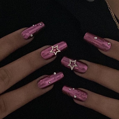 Pink chrome nails with 3D gems are a simple manicure design idea for New Year's Eve 2023 nails.