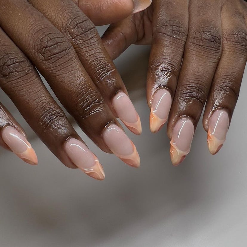 3D peach French tip nails are an on-trend peach fuzz nail design for 2024.