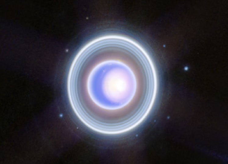 image of a blue and white planet with rings on a starfield background
