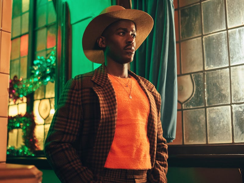 Ncuti Gatwa as the Doctor in the checked suit and hat.