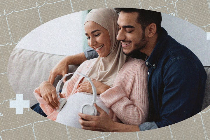 An expecting dad and mom put headphones on mom's baby bump.