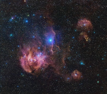 image of a glowing pink and blue cloud of gas in space