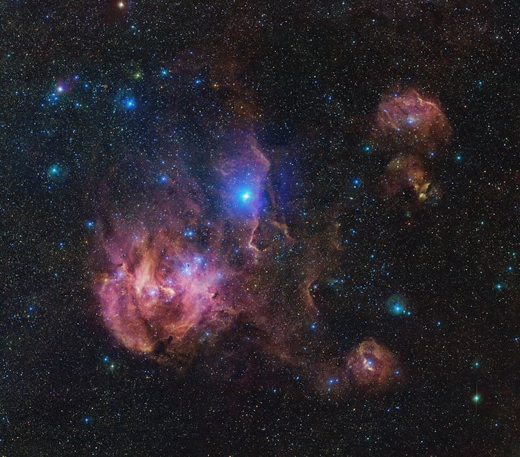 image of a glowing pink and blue cloud of gas in space