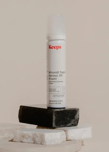 A bottle of Keeps minoxidil foam.