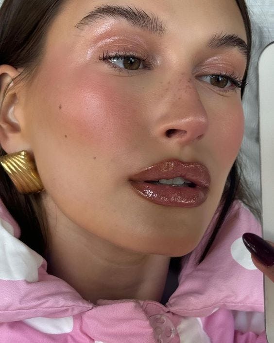 Hailey Bieber's new micro bow tattoo will be the hottest tattoo trend in 2024.