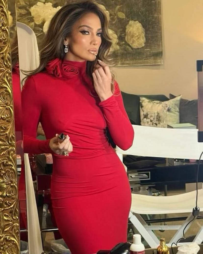 Jennifer Lopez wore a skin-tight red maxi dress perfect for holiday parties