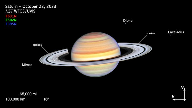 Planet Saturn with bright white rings, multi-colored main sphere, and moons Mimas, Dione, and Encela...