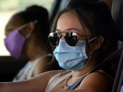 Gideon Adlon wears a face mask in 'Sick'