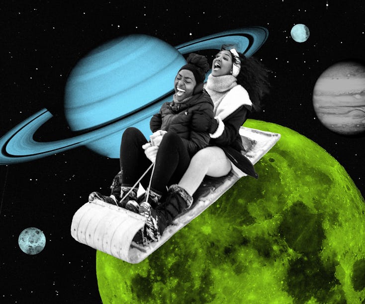 Two women sledding on a planet after reading their January 2024 horoscope.