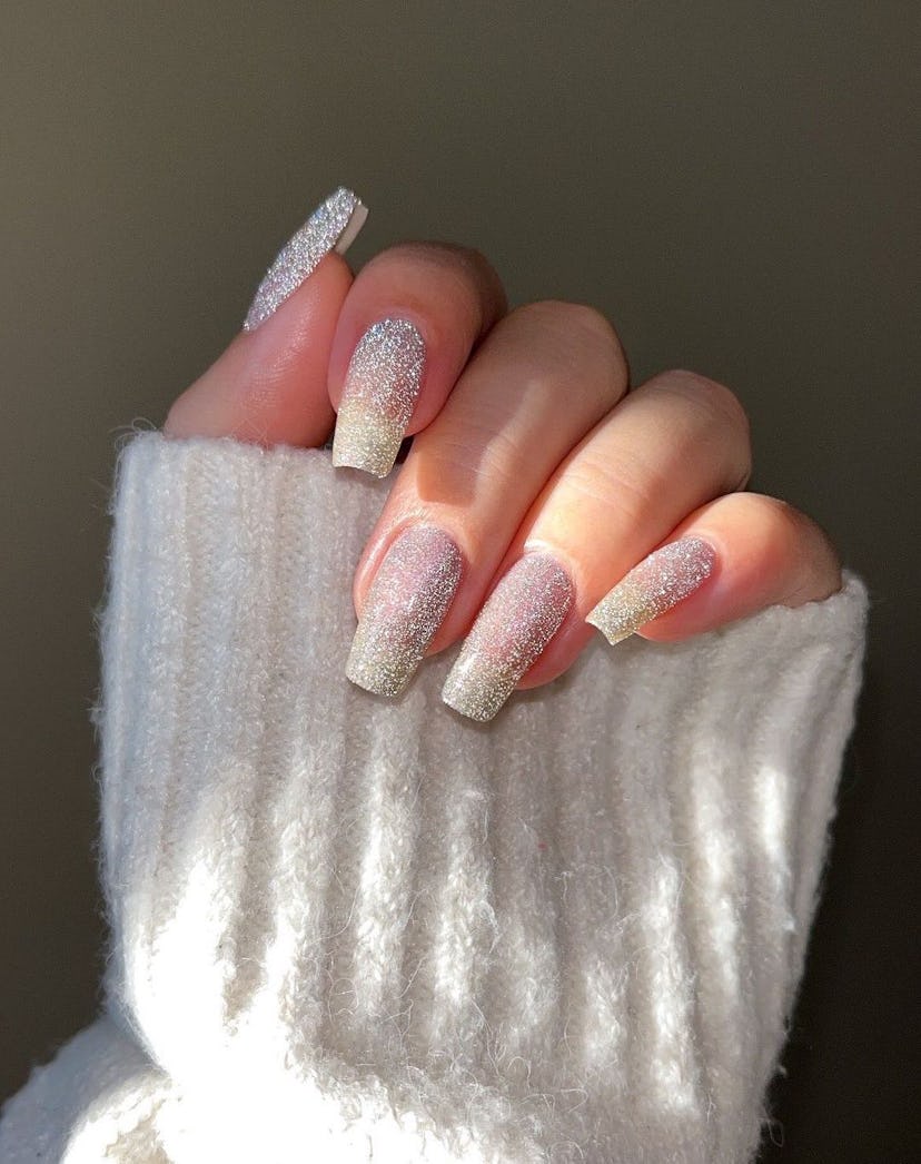 One of the most popular winter nail polish color trends for 2024 is sparkling silver.