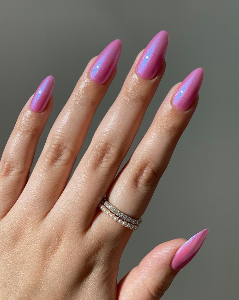 One of the most popular winter nail polish color trends for 2024 is pink chrome.
