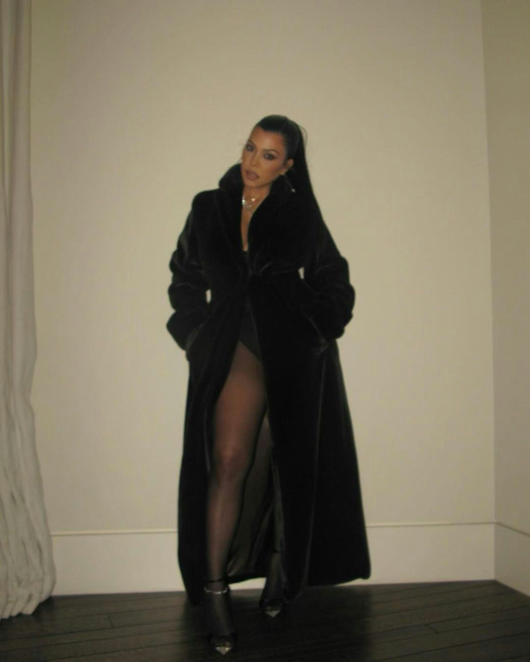 Kourtney Kardashian Barker wears a no-pants ensemble to the KarJenner&rsquo;s 2023 Christmas party.