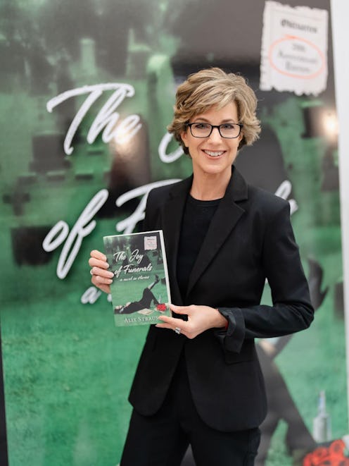 Alix Strauss holding a copy of her book, 'The Joy of Funerals'