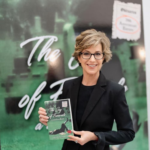 Alix Strauss holding a copy of her book, 'The Joy of Funerals'