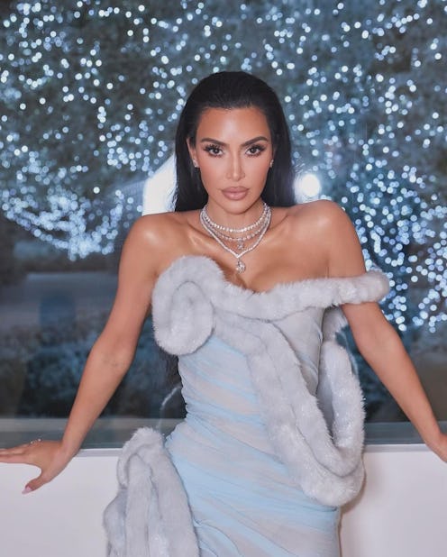 Kim Kardashian wore a Martha May Whovier-inspired archival Mugler 1997 gown for her annual Christmas...