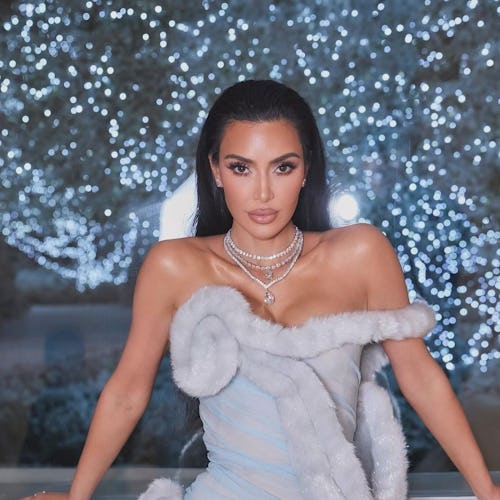 Kim Kardashian wore a Martha May Whovier-inspired archival Mugler 1997 gown for her annual Christmas...