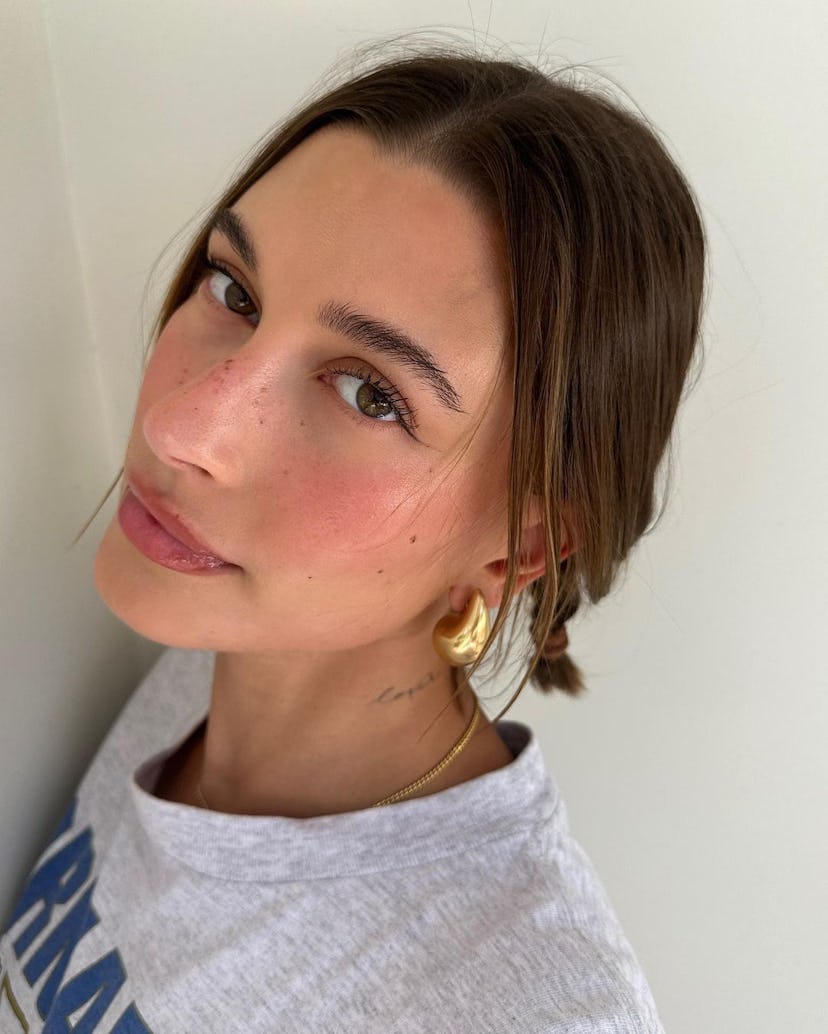 Hailey Bieber's "strawberry girl makeup" featured a standout lip combo in 2023.