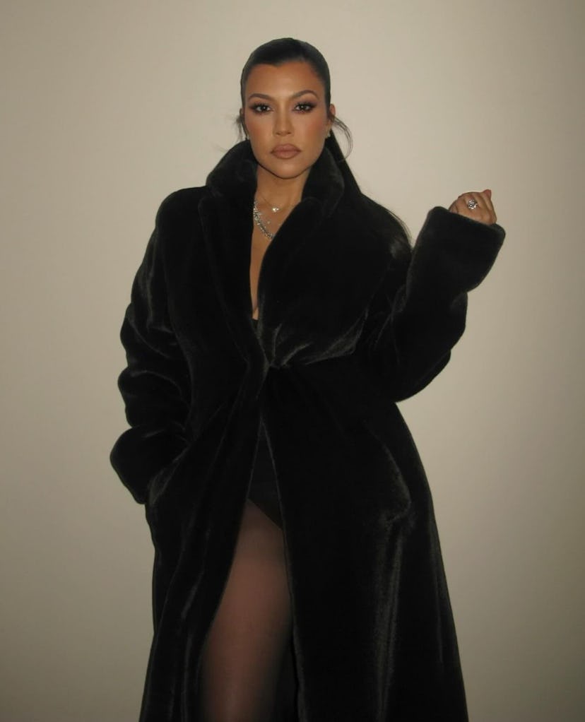 kourtney kardashian wears a black fur coat at family christmas eve party 2023