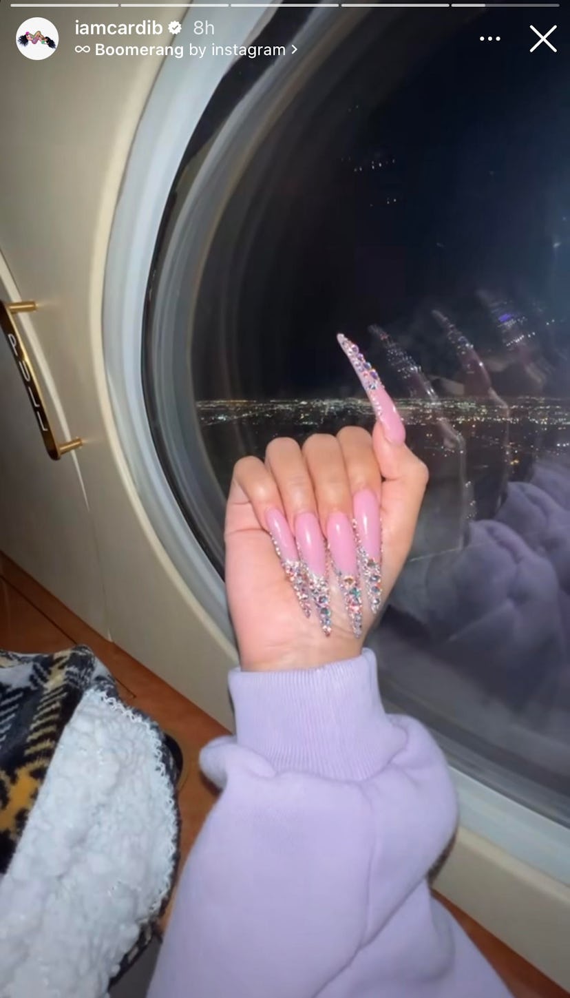 Ahead of New Year's Eve, Cardi B takes to her Instagram stories to share her bedazzled French tip ma...