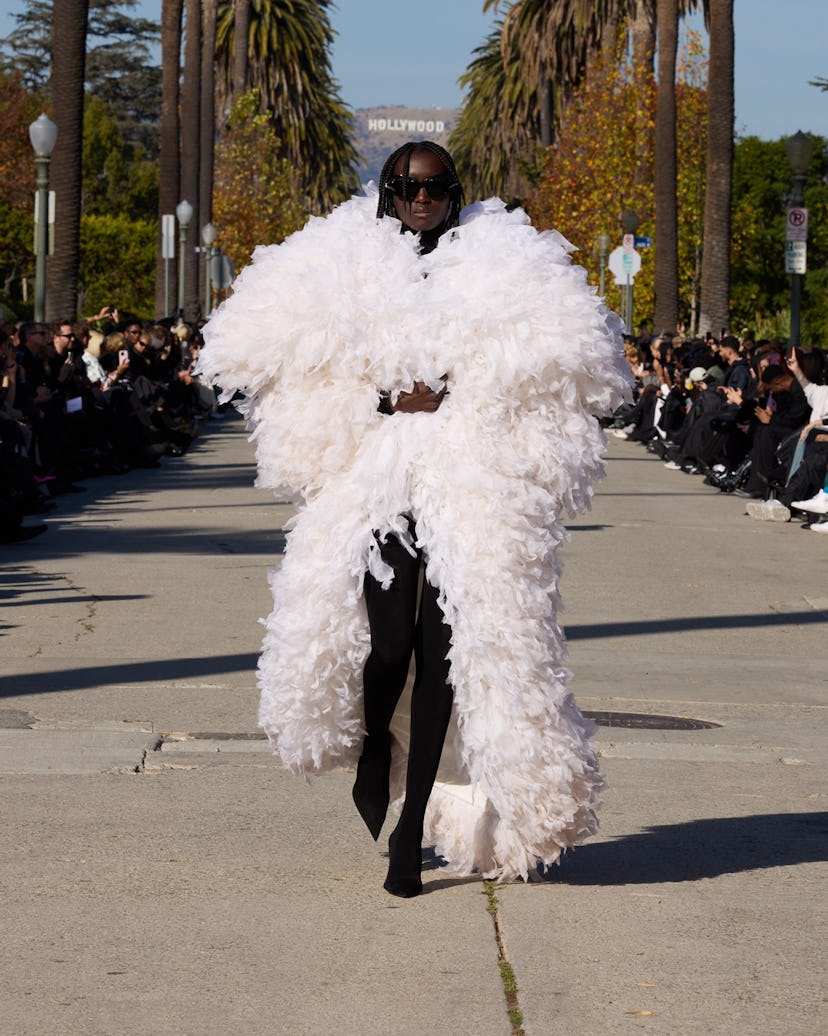 A model walks the runway in a fluffy coat