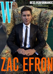 Zac Efron wears a Celine Homme by Hedi Slimane jacket, shirt, pants, and tie.