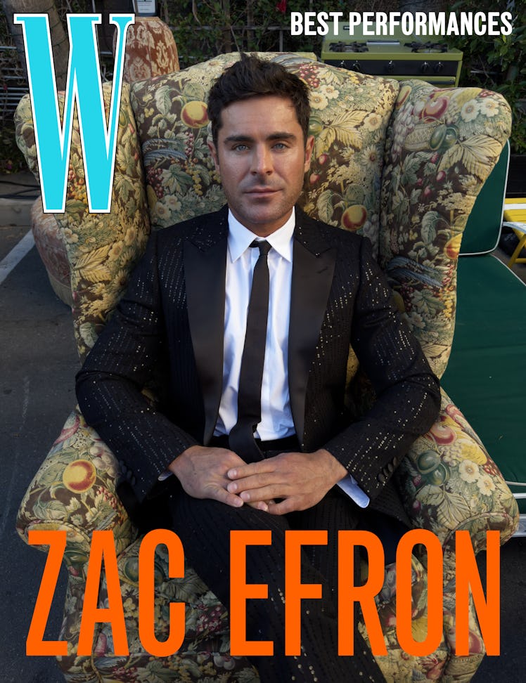 Zac Efron wears a Celine Homme by Hedi Slimane jacket, shirt, pants, and tie.