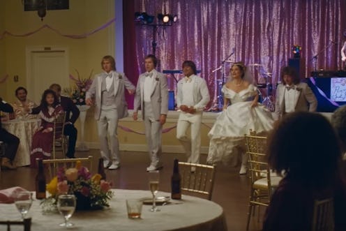 Zac Efron, Lily James, and Jeremy Allen White line dance with their 'Iron Claw' co-stars in the wedd...