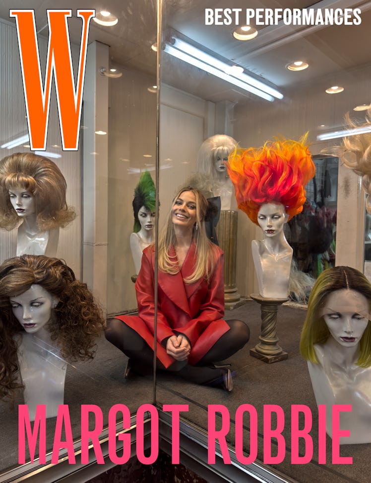 Margot Robbie wears an Hermès coat; Bode bow barrette; Tiffany & Co. earrings; Wolford tights; Jimmy...