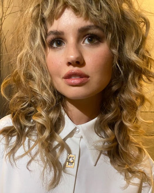 Debby Ryan has found her signature haircut for her curly hair in the trending "wolf cut."