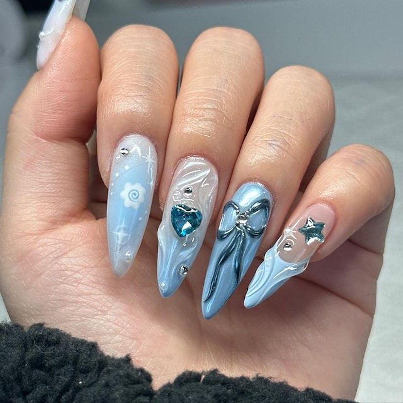 Blue icy nails with silver details.
