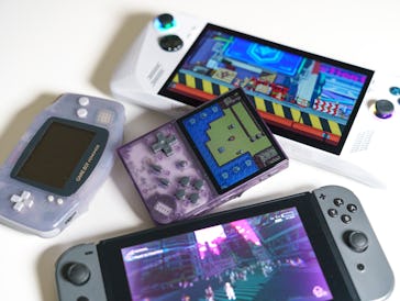Four handhelds on a table: Asus ROG Ally, Nintendo Switch, Anbernic RG35XX Plus, and Game Boy Advanc...