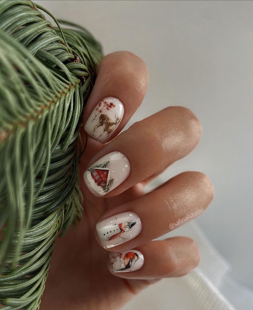 Serving some festive manicure inspo for holiday nails in 2023, this manicure has intricate red cabin...