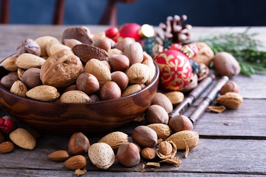 Holiday whole mixed nuts and cracker, in a story about whether it's safe for toddlers to eat whole m...