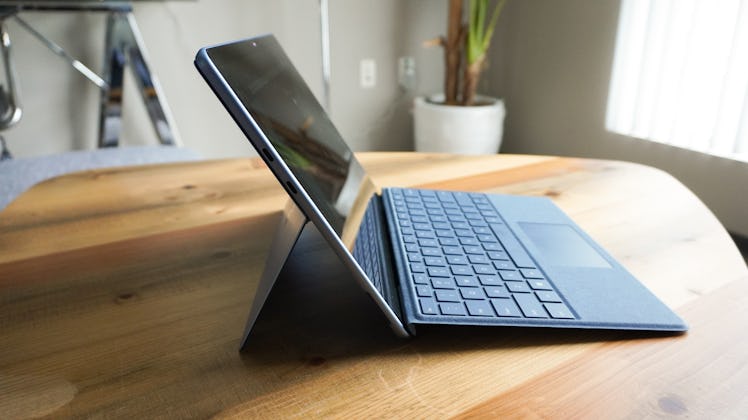 The Surface Pro 9 on a wooden coffee table.